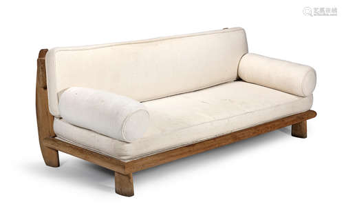 Pale oak frame, wool upholstered cushions with toggle fastenings, 207cm wide x 103cm deep x 82cm high  Attributed to Guillerme et Chambron, A sofa, 1940s