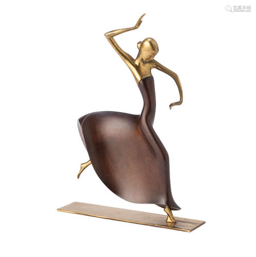 STAMPED MAKER'S MARKS, CIRCA 1925 a Hagenauer brass and stained wood model of a female Dancer