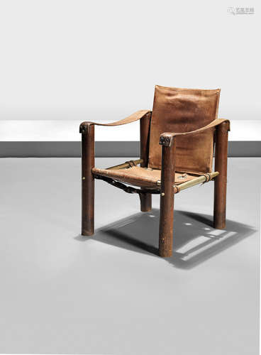 Oak, anodised aluminium torpedo-shaped rails with matt-gold finish, thick tan leather hide with metal hoops and canvas backing 58cm x 56.5cm x 74.5cm  Attributed Eileen Gray,  A Labourdette armchair, designed c.1923 this example probably executed 1930s