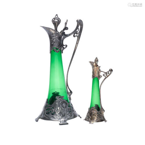 STAMPED MAKER'S MARKS, CIRCA 1900 a wmf pewter figural art nouveau decanter with hinged stopper and green glass liner