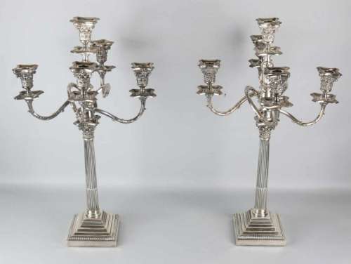 Two special silver candlesticks, 925/000, on square base with pearl rim with a corinthian column and