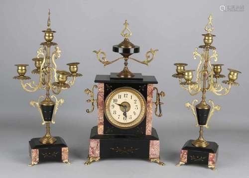 Antique French black and marble clock set with candlesticks and brass. Circa 1880. Eight day still