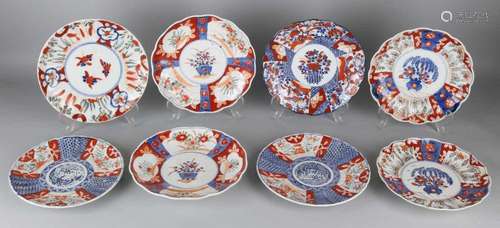 Eight times 19th century Japanese Imari porcelain plates. Divers. Two with hair cracks.