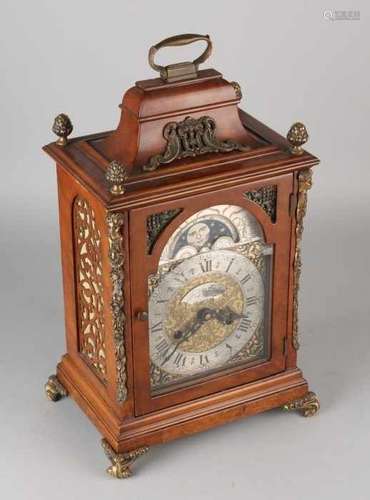 Large walnut table clock with moon stand and bronze fittings. 20th century. England. Percussion