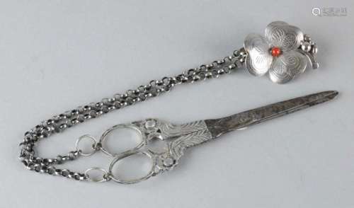 Scissors with silver handles with silver chain and skirt hook in flower shape with red coral. 800/
