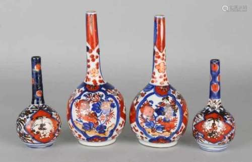 Four pieces of 19th century Japanese Imari porcelain pipe vases with floral decor. Size; 13 - 18 cm.