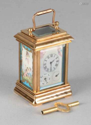 Small old mini travel alarm clock. Brass with porcelain plaques + seconds and day indication.