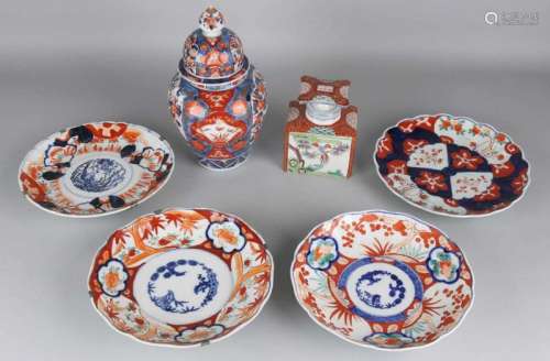 Six times antique Japanese Imari porcelain. 19th century. One tea caddy, good. One cover vase,