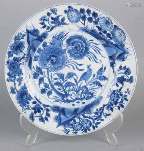 17th - 18th Century Chinese porcelain Kang Xi plate with bird in garden decor. Size: ø 21 cm. In