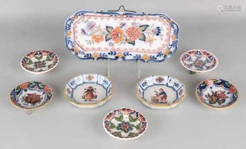 Eight parts of old Dutch Makkum pottery and polychrome. Consisting of: Seven wall plates and one