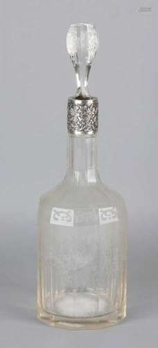 Antique carafe with etched editing with cartouches, volutes and floral decor. With silver frame with