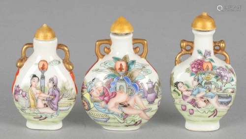 Three old erotic Japanese / Chinese porcelain snuff bottles with gold decor. Marked. 20th century.