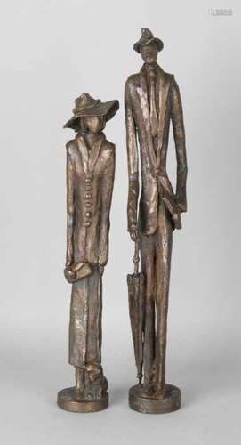 Two large modern bronze figures. Lady and gentleman with cloak and hat. Second half of the 20th