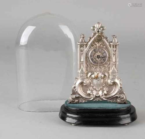 Small German plated Vorderzappler miniature clock under cover. Circa 1900. One hand is missing.