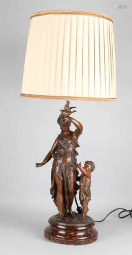 Antique standing composition metal lamp. Antique double figure, Greek woman with child.