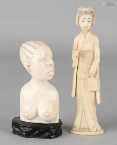 Two antique ivory sculptures: 1x Antique African ivory female bust on basement. Circa 1930. Size: 10