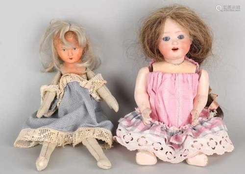 Two antique dolls Germany. One porcelain Heubach Koppelsdorf 300/10, with real hair + paper maché