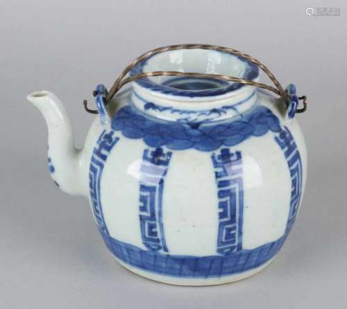 Old Chinese porcelain pot with metal handles and symbols. Chip spout. Size: 10 x 10 x 10.5 cm ø.