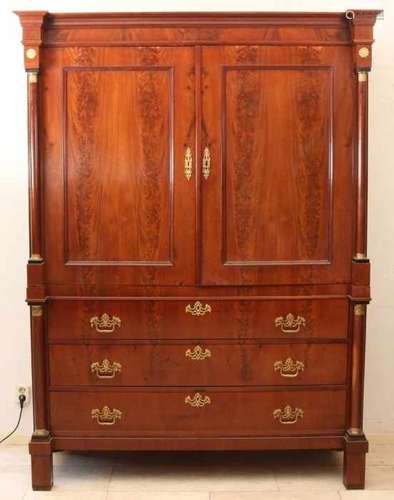 Beautiful restored mahogany Empire cabinet with gilded decorations and capitelles. Circa 1820. Size: