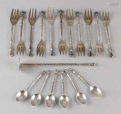 Lot of silver spoons and forks, 835/000, with 11 pastry forks and 6 bubble spoons and a pestle.