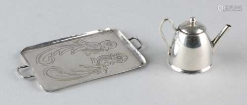 Silver miniature tray with teapot. Tray with ear handles and two engraved parrots, with a silver
