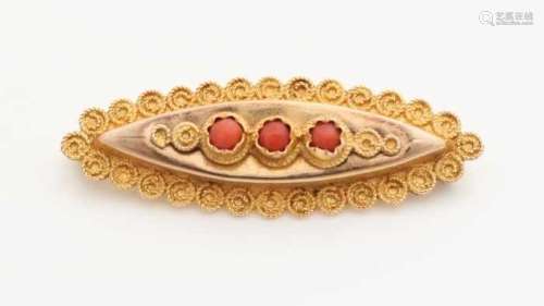 Antique yellow gold brooch 585/000 with blood coral. Navette shaped brooch with a border edited with