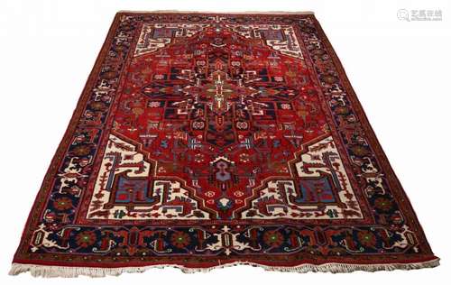 Large old Persian rug in the colors red, blue and brown. Abstract floral. Size: 300 x 202 cm. In