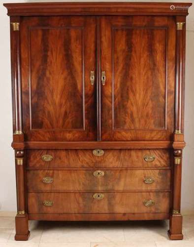 Dutch mahogany Empire cabinet with full columns and brass fire-gilt capitals. With original