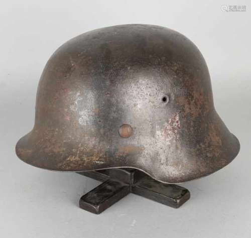 German WW II M-35 iron helmet with leather inner helmet. Patina. Size: 17 x 24.5 x 28 cm. In good