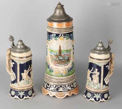 Three old German stoneware beer mugs with music box. 20th century. Size: 22 - 34 cm. In good