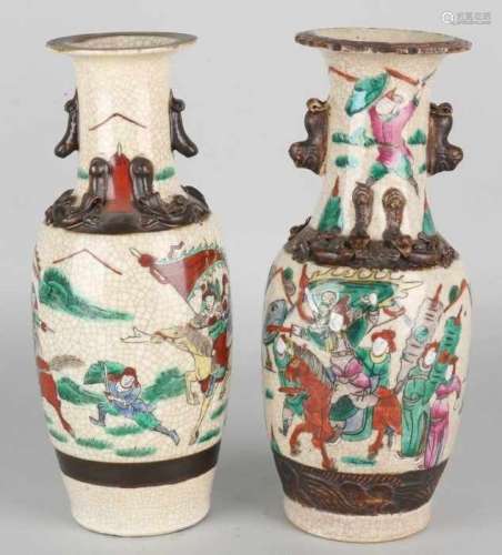 Two antique Chinese Cantonese vases. Circa 1930 or older with warriors and salamanders decor.