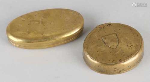 Two antique brass tobacco boxes. Once oval, 18th - 19th century, unclear decor. One 18th century