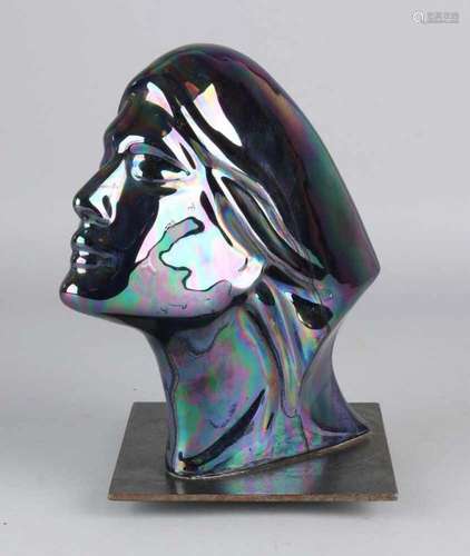 Art Deco ceramic lady's head with blue-green iridescent glaze. On metal base. Circa 1930. Size: 23 x