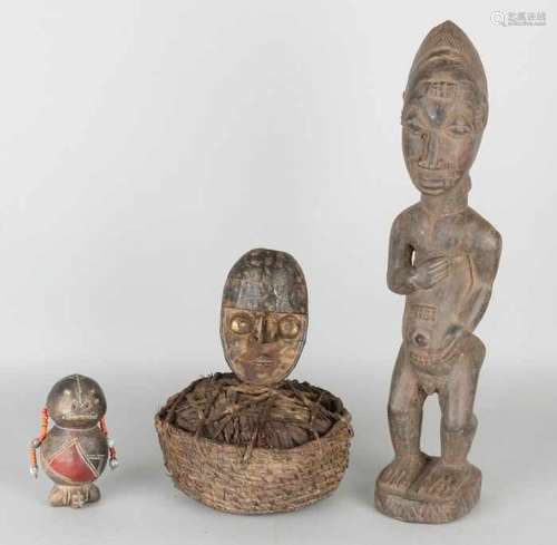 Three African figures. Among others: Cameroon leather doll, Bamoen tribe. Fetisch image, Ivory