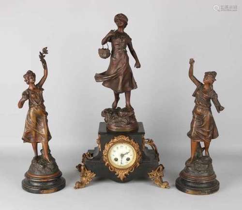 Antique French statues-clock set with black marble. Circa 1870. Clock has eight-day clock, half-hour