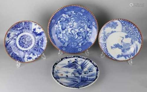 Four large 19th century Imari porcelain dishes with various decors. Among others: cranes, landscape,