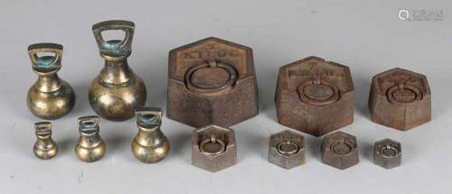 Two sets of 19th century weights. English. From iron and brass. Size: 4 - 10 cm. In good