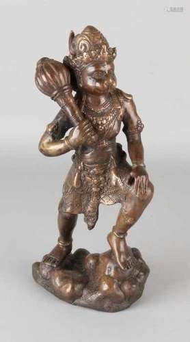 Old / antique Oriental bronze buddha figure, feline with club. Size: H 30 cm. In good condition.