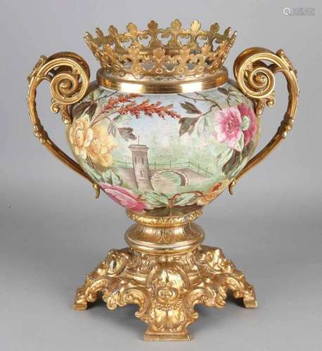 19th Century ceramic vase with gilded bronze frame. Floral decors and cherub heads. Crack when