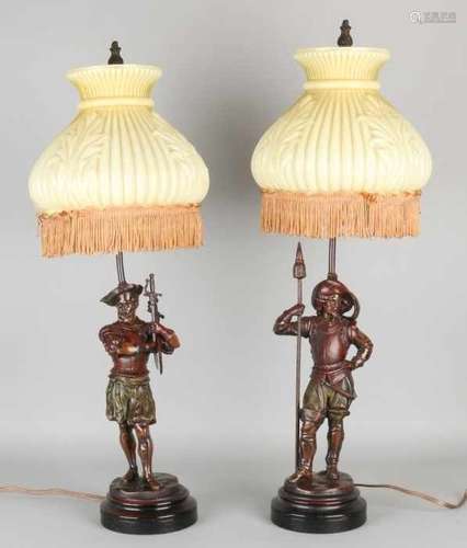 Two old composition metal lamps with figures, 17th century knight figures. With glass caps. Second