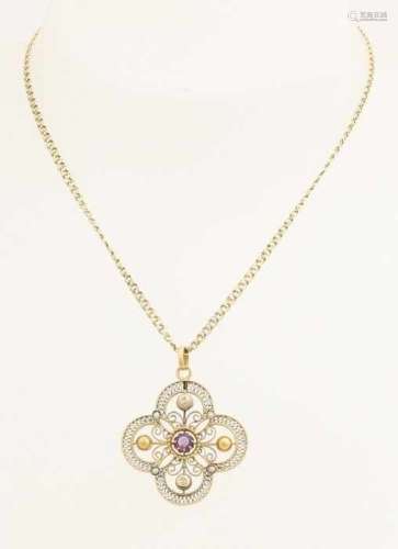 Antique yellow gold pendant with necklace, 585/000. A flower-shaped pendant made of filigree with
