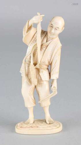 Antique Japanese ivory okimono figure. Harvesting vegetables with scythe. Soil brand. Size: 11 cm.