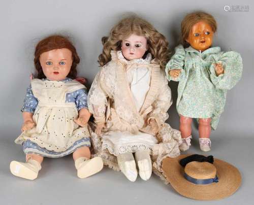 Three antique German dolls. Consisting of: Porcelain doll, Nr. 3200, bellows, hairline neck, with