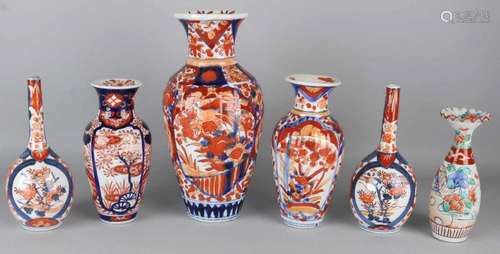 Six times 19th century Japanese Imari porcelain. Floral. Consisting of: Two pipe vases, one chip.