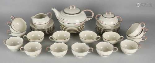 Porcelain Art Deco tableware. Cream with chrome. Circa 1930. Consisting of: Tea can, sugar + milk