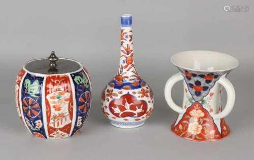 Three times antique Japanese Imari porcelain. Consisting of: Drinking cup with three ears, chip.