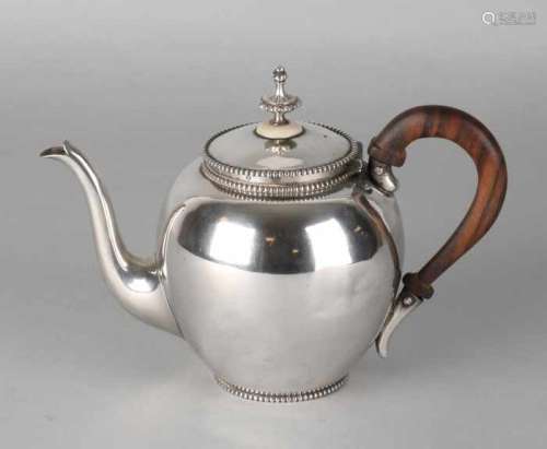 Silver teapot, 835/000, round sphere model decorated with pearl rim and wooden handle. MT .: Van