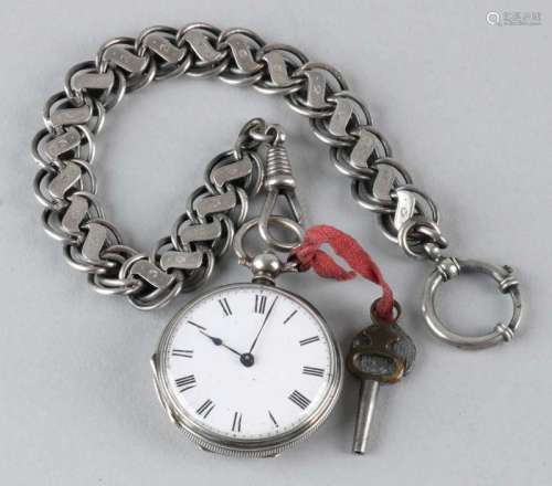 Silver pocket watch, ø36 mm, with key winding, with chain with a bevel mark switch. 27 cm. In good