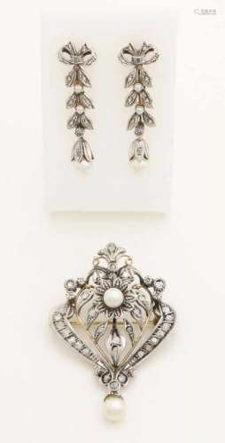Beautiful gold with silver brooch and earrings with diamonds and pearls, 585/000 and 835/000. Brooch
