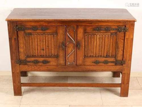 Oak Gothic-style two-door cabinet with letter panels and iron fittings. 20th century. Size: 81 x 120